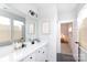 Bright bathroom with a white vanity and modern fixtures at 2254 Electric Ln, Charlotte, NC 28205
