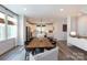 Bright dining area with a modern chandelier and view into the kitchen, creating a seamless flow at 2254 Electric Ln, Charlotte, NC 28205