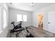 Bright exercise room featuring modern equipment, light gray walls, and a view into an attached bathroom at 2254 Electric Ln, Charlotte, NC 28205
