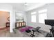 Bright exercise room with hardwood floors, weight bench, and workout equipment at 2254 Electric Ln, Charlotte, NC 28205