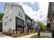 Charming townhome exterior with colorful accents and well-maintained landscaping at 2254 Electric Ln, Charlotte, NC 28205