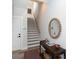 Foyer with hardwood floors, staircase, and stylish decor at 2254 Electric Ln, Charlotte, NC 28205