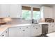 Beautiful kitchen featuring white cabinets, stainless steel appliances, and a functional layout for cooking at 2254 Electric Ln, Charlotte, NC 28205