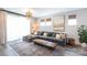 Comfortable living room with plush sectional sofa, stylish rug, and elegant chandelier, perfect for relaxation at 2254 Electric Ln, Charlotte, NC 28205