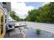 Relax on this outdoor patio featuring stylish furniture and string lights perfect for entertaining or enjoying quiet evenings at 2254 Electric Ln, Charlotte, NC 28205
