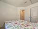 Cozy bedroom featuring a floral comforter with access to a closet at 2715 Sydney Overlook Ln, Charlotte, NC 28269