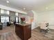 Inviting open floor plan showcases the kitchen island connecting the living and dining spaces at 2715 Sydney Overlook Ln, Charlotte, NC 28269