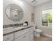 Bathroom featuring granite countertops, octagonal mirror and soft natural light at 300 Hugh Crocker Rd, Matthews, NC 28104