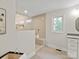 Bright bathroom featuring a spacious walk-in shower with bench and neutral tile at 300 Hugh Crocker Rd, Matthews, NC 28104
