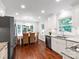 Dining room with abundant natural light, hardwood floors, stylish lighting and white cabinetry at 300 Hugh Crocker Rd, Matthews, NC 28104