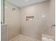 The walk-in shower featuring sleek tile, built-in niche, and modern fixtures at 300 Hugh Crocker Rd, Matthews, NC 28104