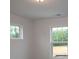 Bright bedroom with a window overlooking a green landscape at 3156 Lilac Grove Dr, Charlotte, NC 28269