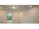 Bright bedroom with a window overlooking a green landscape at 3156 Lilac Grove Dr, Charlotte, NC 28269