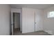 Bedroom featuring carpet floors, a window and a white door at 3156 Lilac Grove Dr, Charlotte, NC 28269