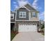 Charming two-story home with stone accents and a two-car garage at 3156 Lilac Grove Dr, Charlotte, NC 28269