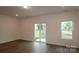Bright living area with a sliding glass door and a large window at 3156 Lilac Grove Dr, Charlotte, NC 28269