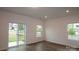Bright living area with a sliding glass door and a large window at 3156 Lilac Grove Dr, Charlotte, NC 28269