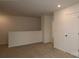Neutral loft space with carpet floors and a bright white wall at 3156 Lilac Grove Dr, Charlotte, NC 28269