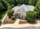 Clubhouse with lush landscaping and a sidewalk at 3825 Mountain Cove Dr, Charlotte, NC 28216