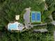 Aerial view of community pool, tennis courts, and parking at 3825 Mountain Cove Dr, Charlotte, NC 28216
