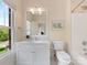 Bathroom with bright natural light, a white vanity, and a shower-tub combo at 3825 Mountain Cove Dr, Charlotte, NC 28216