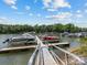 Community boat dock with multiple boat slips available on the lake at 3825 Mountain Cove Dr, Charlotte, NC 28216