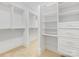 Walk-in closet featuring built-in shelving and drawers for storage solutions at 3825 Mountain Cove Dr, Charlotte, NC 28216
