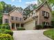 Beautiful brick home with well-manicured landscaping and a spacious driveway at 3825 Mountain Cove Dr, Charlotte, NC 28216