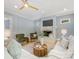 Cozy living room with a fireplace, comfortable seating, and modern lighting at 3825 Mountain Cove Dr, Charlotte, NC 28216