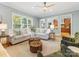 Bright and airy living room with comfortable seating and views into the kitchen at 3825 Mountain Cove Dr, Charlotte, NC 28216