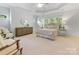 Bright and spacious primary bedroom with a trey ceiling, carpet flooring, and large windows at 3825 Mountain Cove Dr, Charlotte, NC 28216