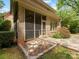 Enclosed brick patio area with screened-in porch and brick paver extension at 3825 Mountain Cove Dr, Charlotte, NC 28216