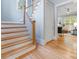 Beautiful stairway with hardwood steps, leading to the upper level at 3825 Mountain Cove Dr, Charlotte, NC 28216