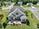 An aerial view of the home with a large backyard and outdoor dining area at 4321 Tucker Chase Dr, Midland, NC 28107