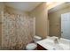 Bathroom featuring a shower with curtain, toilet, sink, and a mirror at 4321 Tucker Chase Dr, Midland, NC 28107