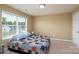 Bedroom featuring a bed with a quilt, window with blinds, and carpeted floors at 4321 Tucker Chase Dr, Midland, NC 28107