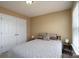 Carpeted bedroom with neutral paint, bedside tables and a closet with double doors at 4321 Tucker Chase Dr, Midland, NC 28107