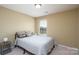 Neutral bedroom with carpet, bed with pillows and a window offering a view at 4321 Tucker Chase Dr, Midland, NC 28107