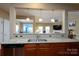Spacious kitchen featuring granite countertops, stainless steel sink, and views into the living room at 4321 Tucker Chase Dr, Midland, NC 28107
