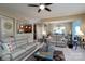Inviting living room with plush sofas, stylish decor, and an open view to the kitchen at 4321 Tucker Chase Dr, Midland, NC 28107