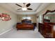 Large main bedroom with tray ceilings and beautiful dark wood furniture at 4321 Tucker Chase Dr, Midland, NC 28107