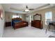 Spacious main bedroom featuring tray ceilings and elegant dark wood furniture at 4321 Tucker Chase Dr, Midland, NC 28107