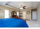 Comfortable main bedroom with tray ceilings, ensuite bathroom, and elegant furniture at 4321 Tucker Chase Dr, Midland, NC 28107