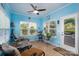 Light-filled sunroom with tile floors and access to the outdoor patio at 4321 Tucker Chase Dr, Midland, NC 28107