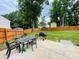 A spacious, fenced backyard with a patio and a table and chairs at 4698 Hannah Dr, Rock Hill, SC 29732