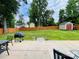 Spacious backyard featuring a patio with outdoor furniture and a storage shed at 4698 Hannah Dr, Rock Hill, SC 29732