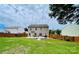 Backyard with patio, barbeque, furniture, and a well-maintained lawn, enclosed by a wooden fence and neighboring houses at 4698 Hannah Dr, Rock Hill, SC 29732