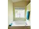 Bright soaking tub sits beneath a window allowing for natural light at 4698 Hannah Dr, Rock Hill, SC 29732