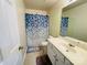Cozy bathroom featuring a single vanity and shower with blue patterned curtain at 4698 Hannah Dr, Rock Hill, SC 29732