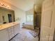 Bright bathroom featuring double vanity, soaking tub, and glass-enclosed shower at 4698 Hannah Dr, Rock Hill, SC 29732